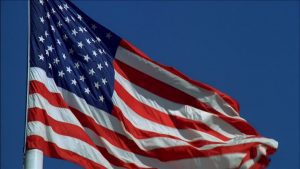 962213192-american-flag-waving-sway-wind-usa